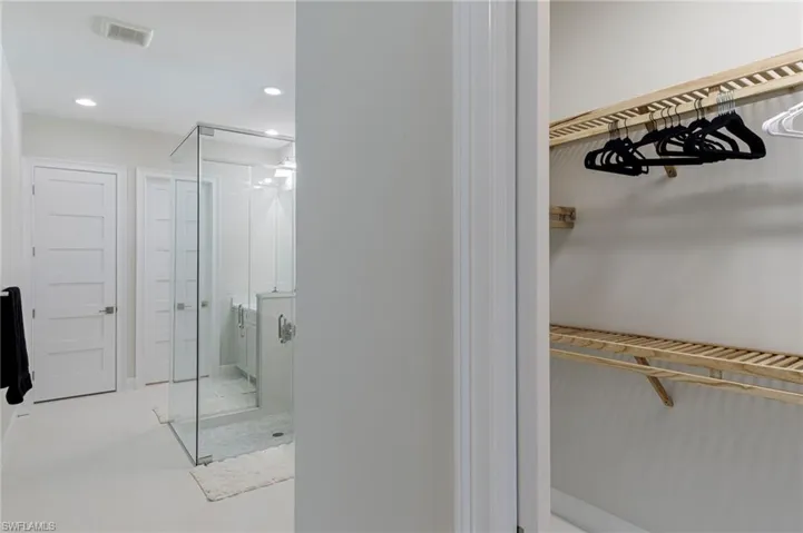 Bathroom featuring a shower with door
