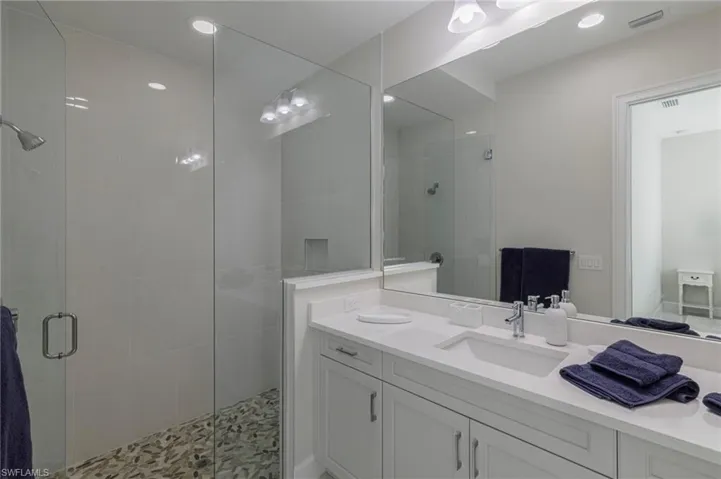 Bathroom featuring vanity and walk in shower