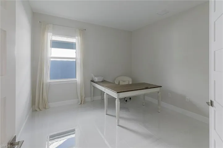 Unfurnished office with light tile patterned floors