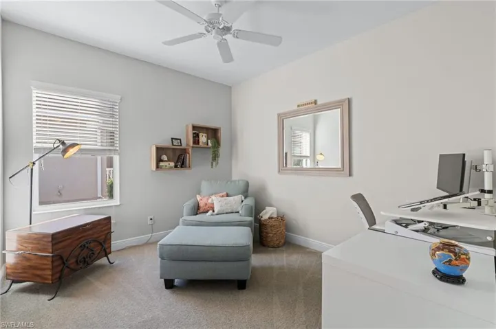 Office featuring light carpet and ceiling fan