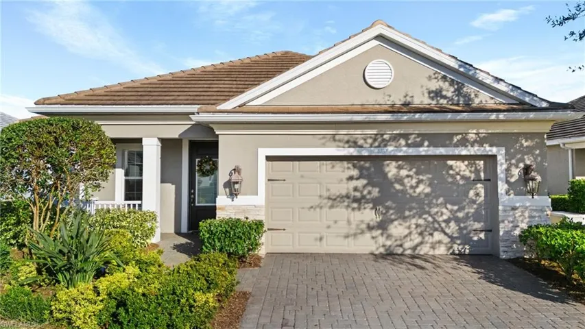 View of front facade featuring a garage
