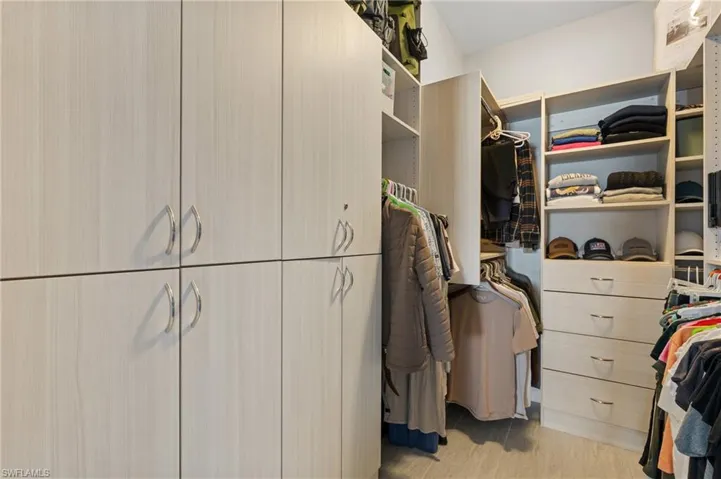 Walk in closet featuring light hardwood / wood-style flooring