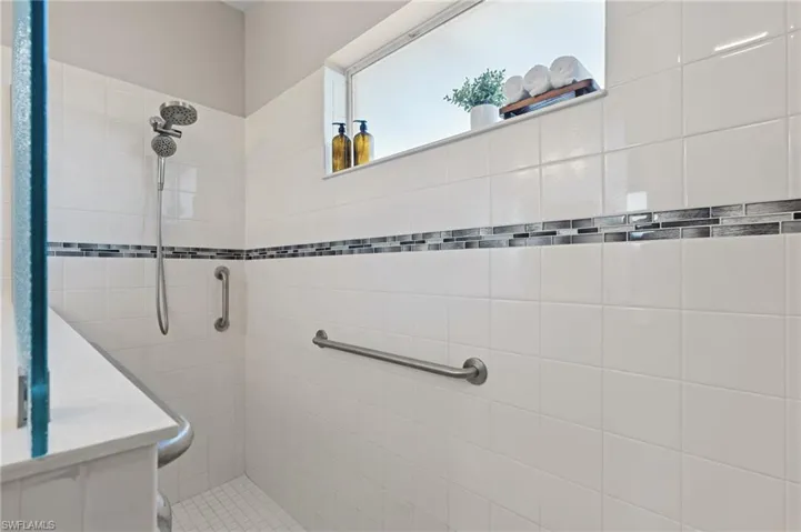 Bathroom featuring a tile shower