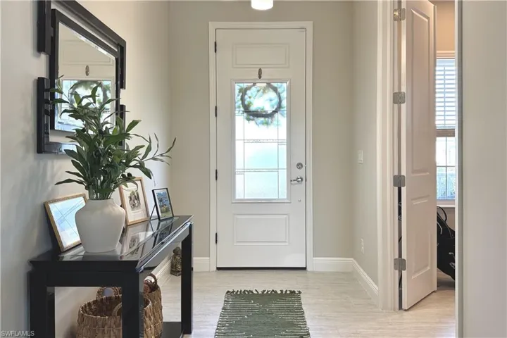 Entryway with light hardwood / wood-style flooring