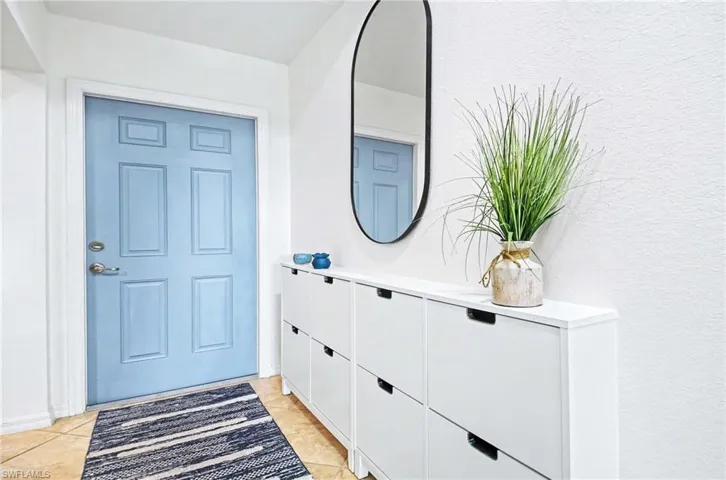 Welcome home!  A convenient entryway storage unit provides a stylish and discreet place to organize shoes and other essentials.