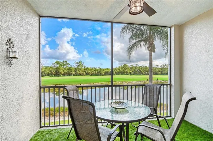Screened lanai with lighted ceiling fan and serene lake, golf course and preserve views.