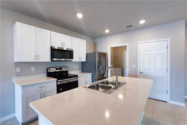 Large center island with white cabinets