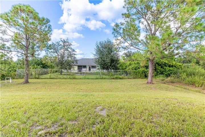View of yard featuring view of wooded area