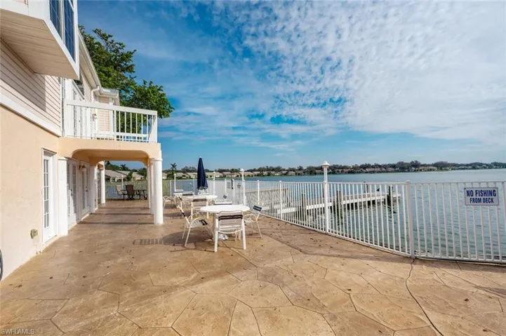 View of patio / terrace with a water view and a balcony
