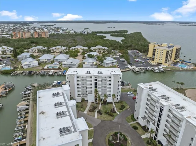 Birds eye view of property featuring a water view