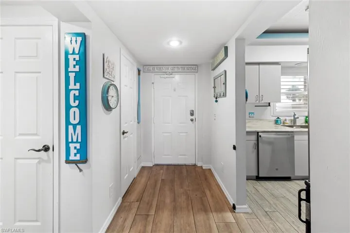 Hallway featuring sink