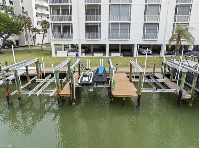 Dock area featuring a water view