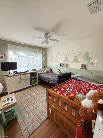 Bedroom featuring light wood-type flooring and ceiling fan