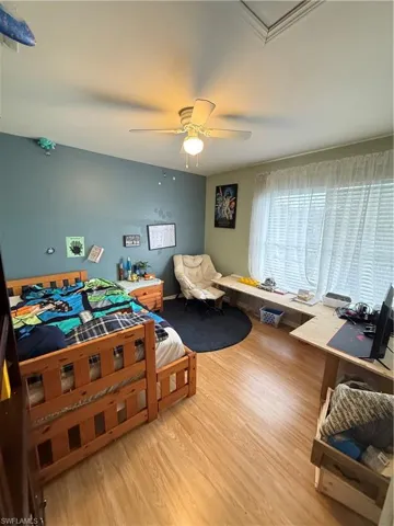 Bedroom featuring light wood-style flooring and a ceiling fan