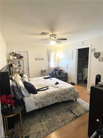 Bedroom with light wood-type flooring and ceiling fan