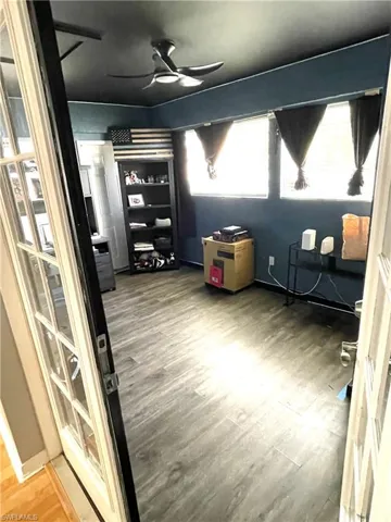 Bedroom with wood-style flooring and ceiling fan
