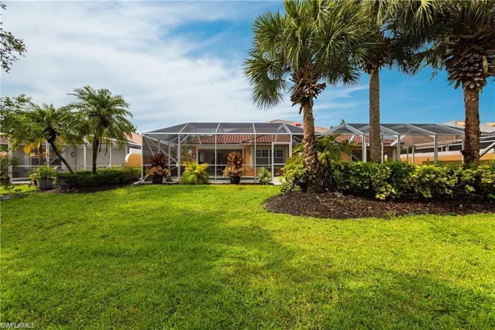 View of yard with a lanai