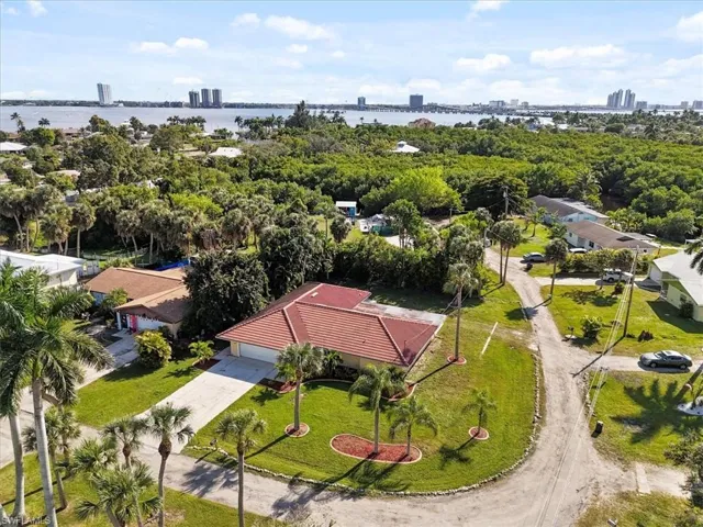 Drone / aerial view of city skyline and a nearby body of water