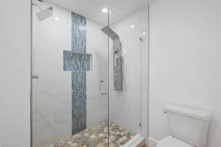 Guest Bathroom #1 with a shower stall and recessed lighting