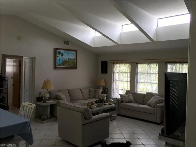 Vaulted ceilings with multiple skylights enhance this living area