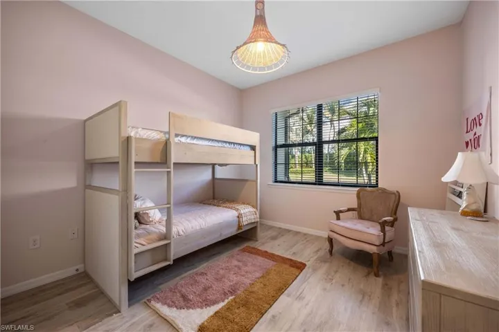 Bedroom with wood-type flooring
