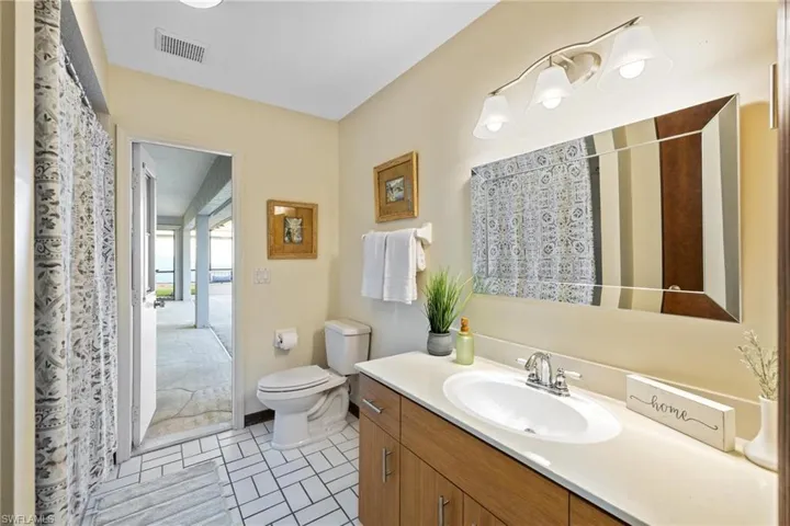 Bathroom with  shower tub combination and access to the lanai