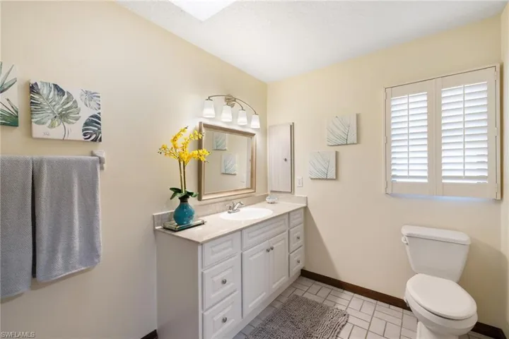 Bathroom featuring walk in shower and linen closet