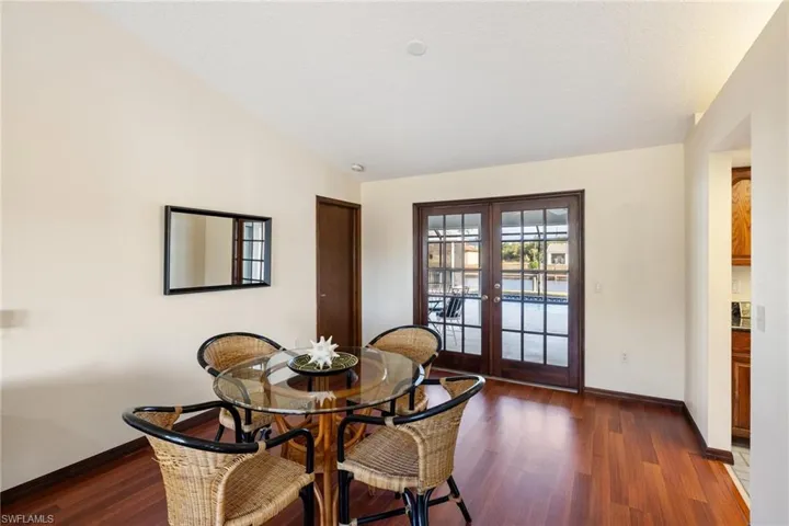 Dining space featuring vaulted ceiling,and  french doors to the lanai