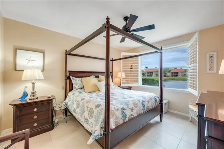 Bedroom with ceiling fan and baseboards