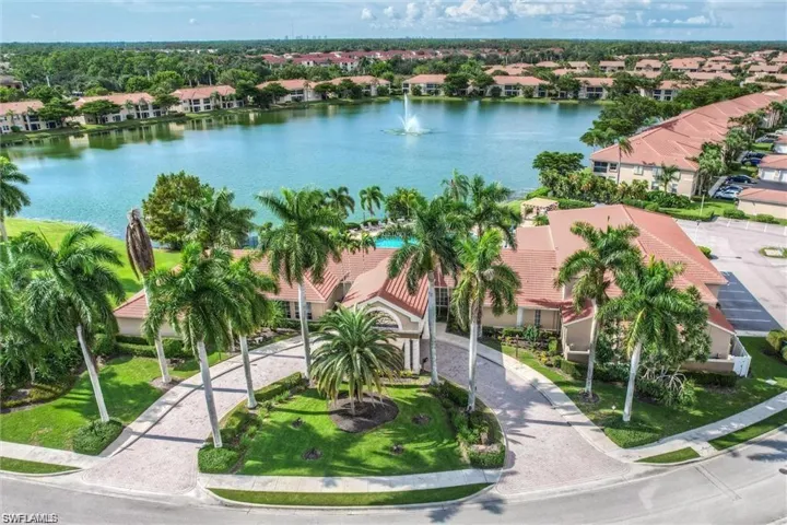 Aerial perspective of suburban area with a large body of water