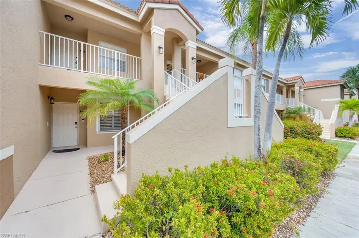 View of property featuring stairs