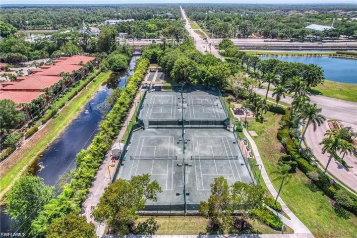 Aerial view of property's location with a large body of water