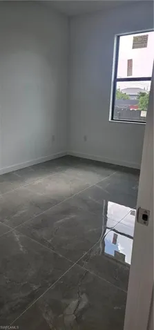 Spare room with baseboards