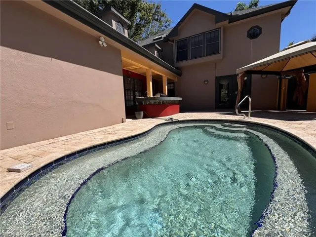 View of dip pool featuring a gazebo and a patio