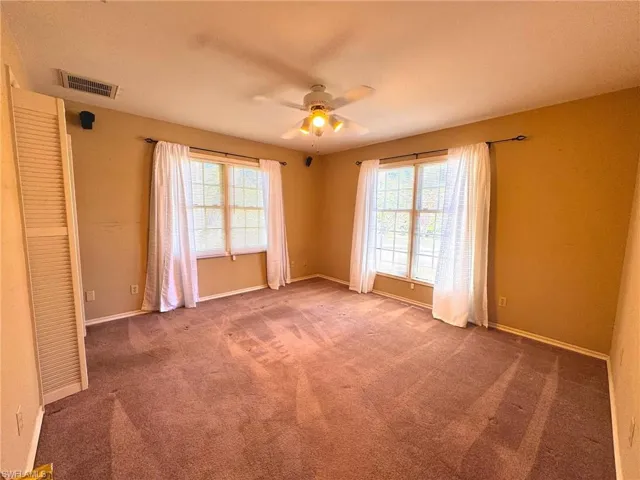 Bedroom 2 with carpet floors, and a ceiling fan