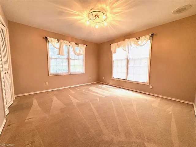 Bedroom 1 with carpet flooring