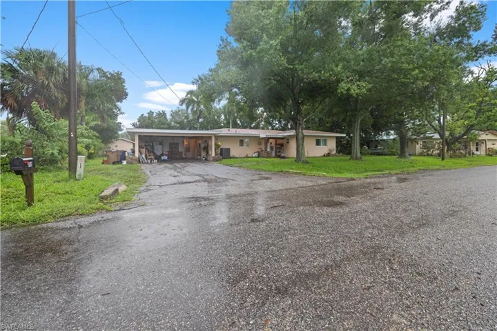 Ranch-style house with a front lawn