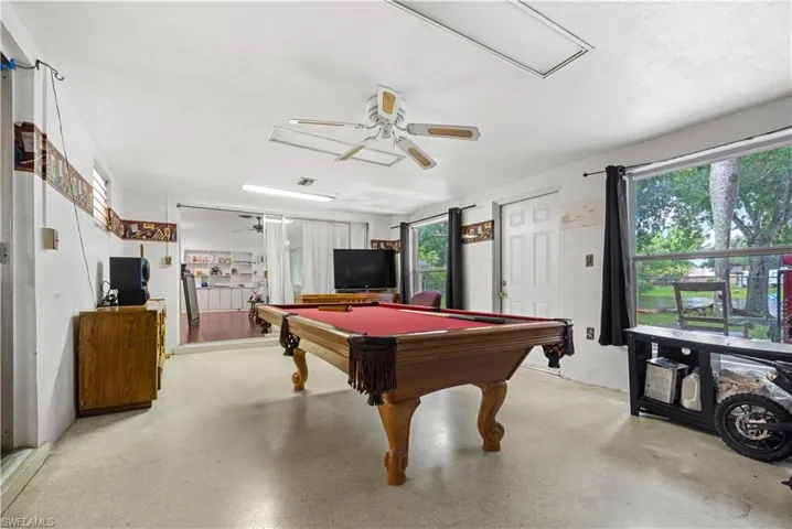 Rec room with a healthy amount of sunlight, ceiling fan, and pool table
