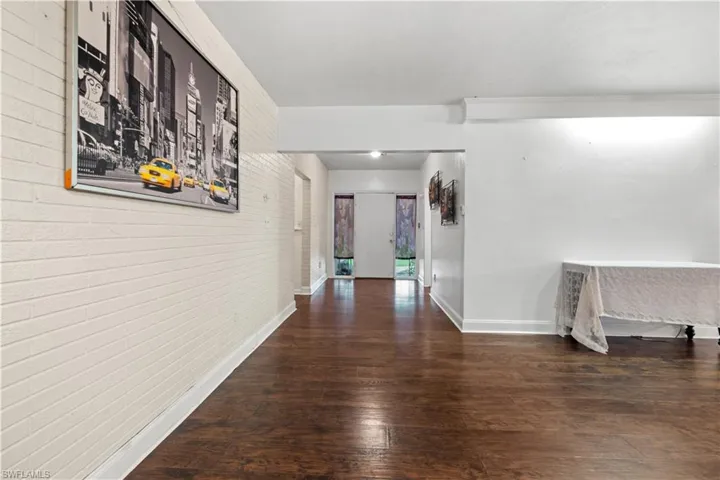 Corridor featuring wood-type flooring