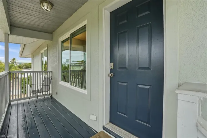 Property entrance with stucco siding - Virtually Edited Image