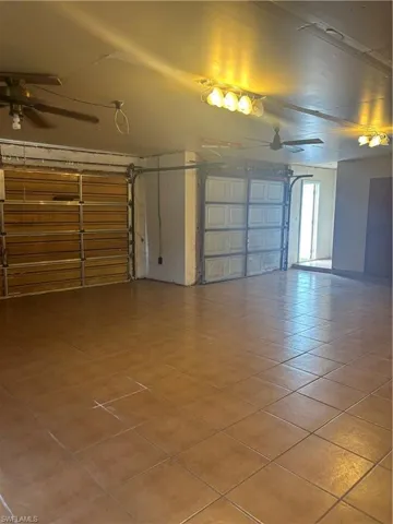 Garage featuring ceiling fan