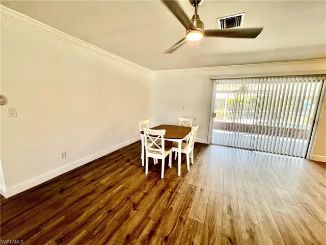 Dining area with LUXURY VINYL PLANK FLOORS.