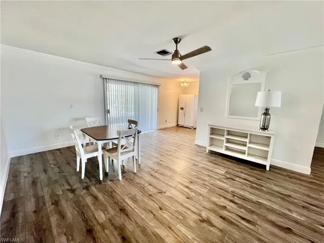 Dining area with LUXURY VINYL PLANK FLOORS.