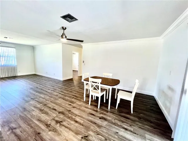 Dining area with LUXURY VINYL PLANK FLOORS.