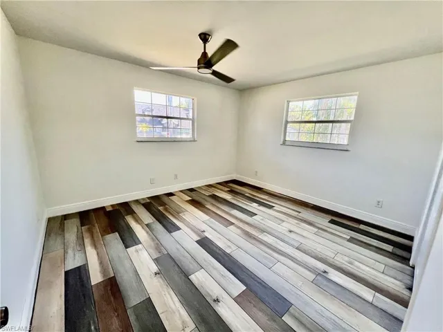 Bedroom featuring LUXURY VINYL PLANK FLOORS.