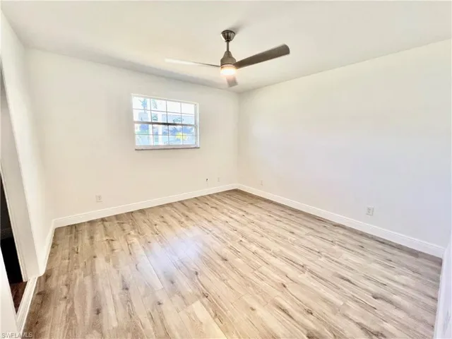 Bedroom featuring LUXURY VINYL PLANK FLOORS.