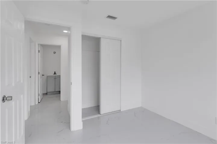 Unfurnished bedroom featuring a closet