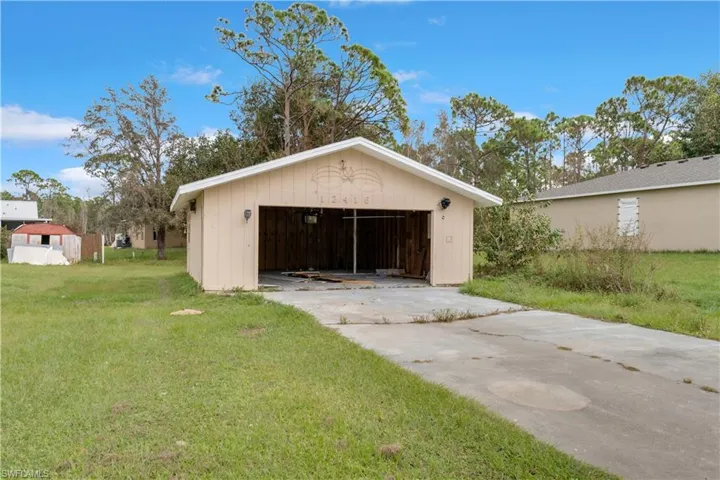 Garage with a lawn