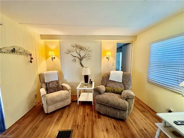 Living area with wood finished floors