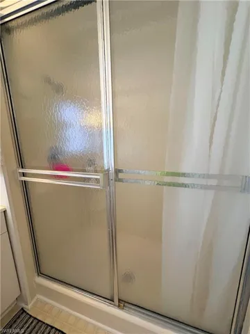 Full bathroom featuring a stall shower and vanity